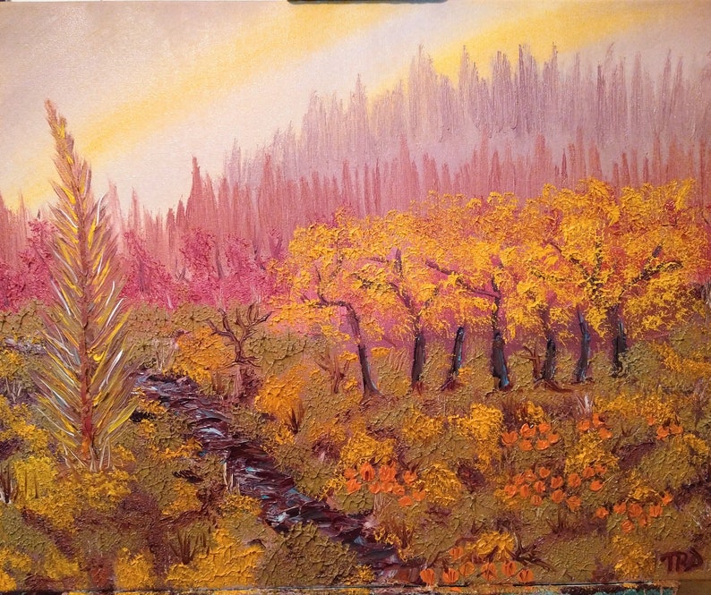 May include: A painting of a forest scene with a stream running through it. The trees are a mix of green, yellow, and orange, and the sky is a soft blue. The painting is done in a realistic style.