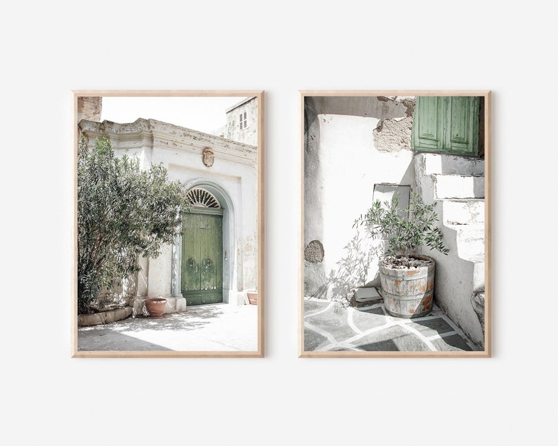May include: Two framed photographs of a white building with a green door and a potted plant. The first photo shows a green door with a white archway and a potted plant in front of it. The second photo shows a potted plant on a white stone patio with a green door in the background.