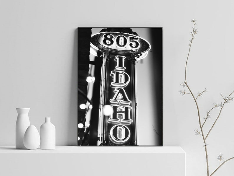 May include: Black and white photograph of a neon sign that reads "805 IDAHO" in a vintage style.