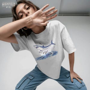 marine life design png with shark jumping and fish swimming, ocean action scene