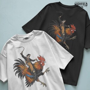 Western humor PNG artwork featuring a cowboy on a large rooster, combining rodeo action and farm animal humor for novelty shirt designs.