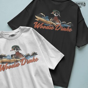 Waterfowl hunting PNG featuring a wood duck drake in natural water surroundings, Woodie Drake graphic for apparel
