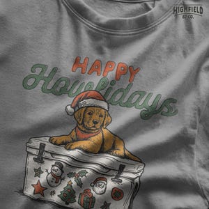 Cute Christmas dog PNG with Labrador wearing Santa hat. Background includes cooler with festive elements like snowman and Santa sticker. Great for funny dog holiday shirts.