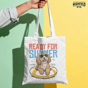 Doodle dog summer PNG showing a fluffy puppy in sunglasses on a yellow swim ring with bold summer text, ideal for beach shirt and vacation graphics.
