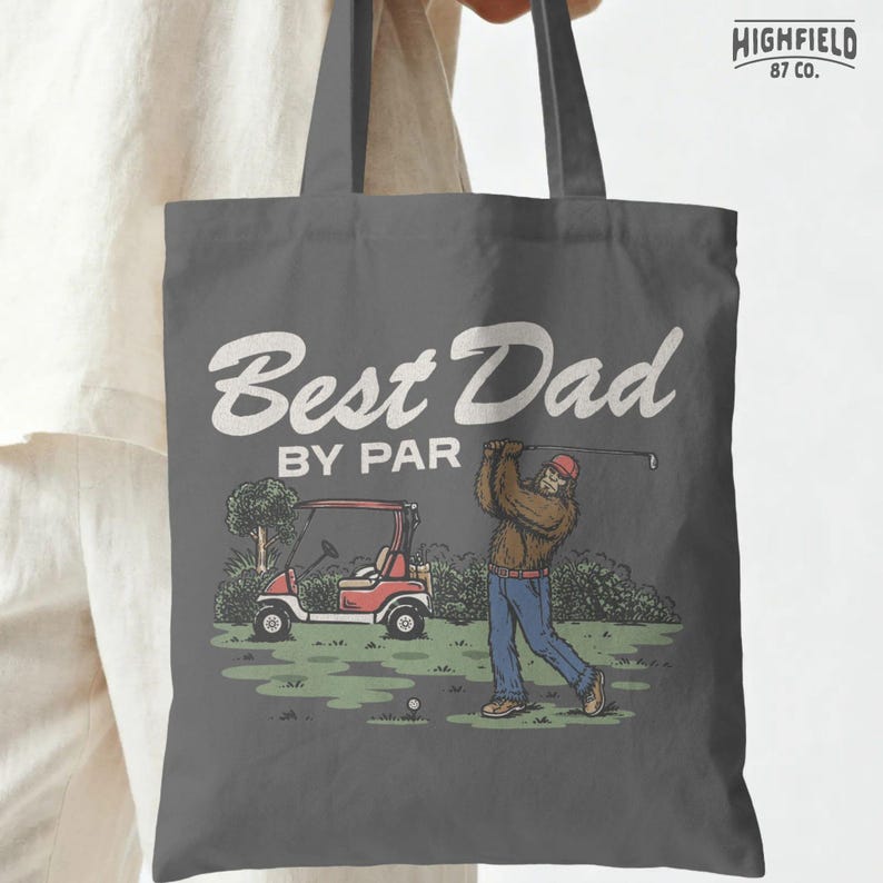 Best Dad By Par PNG artwork with a Bigfoot golfer on a course, golf cart, bold dad text, and funny Fathers Day appeal for digital downloads.