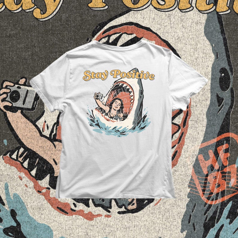 shark illustration with open mouth and woman taking selfie inside, stay positive phrase with ironic humor, funny beach png design for summer shirts and ocean themed apparel