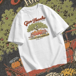 Pumpkin wagon PNG showing a harvest cart filled with pumpkins under a tree with Psalm 107 1 and Thanksgiving faith wording.