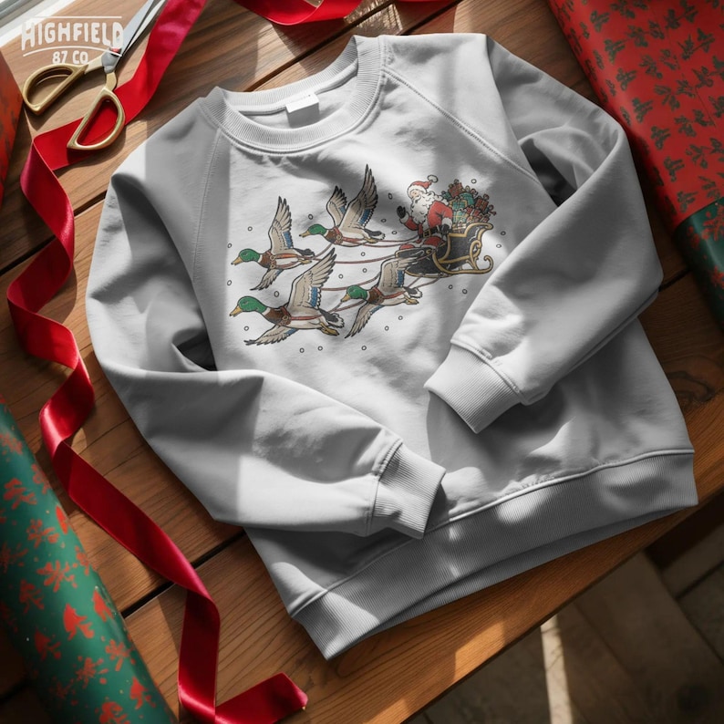 Christmas hunter design with Santa seated in a sleigh pulled by mallard ducks, featuring bold hand-drawn outlines and traditional red, green, gold, and brown colors.