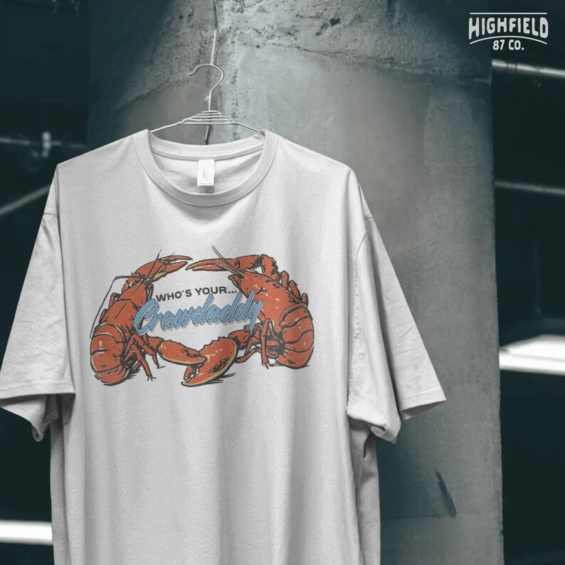 Crawfish boil party shirt design with large crawdad artwork, high quality PNG download.
