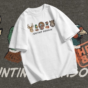 Turkey hunting PNG showing a wild turkey head with deer, mallard duck, pheasant, and boar in a classic hunting season design.