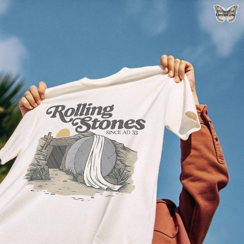 Rolling stone Jesus tomb PNG, cross silhouette sunrise PNG, Christian religious message PNG, Jesus resurrection digital art, biblical scene download PNG, Easter tomb illustration, church bulletin art PNG, cross and grave artwork, risen Christ t-shirt graphic, grace filled Easter art PNG, rolling stones since AD 33 design, Christian hope sunrise PNG, Easter printable card design, vintage ministry art, Christian apparel design PNG, gospel faith wall art PNG, He is risen poster PNG