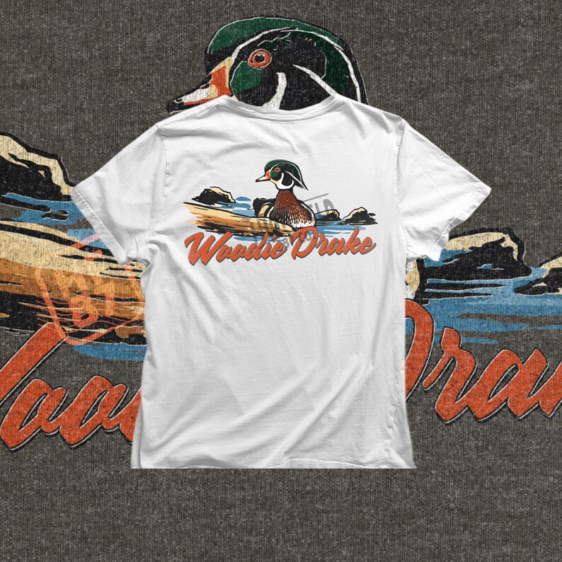 Wood duck waterfowl PNG illustration with a drake duck and Woodie Drake lettering, vintage hunting style design for shirts