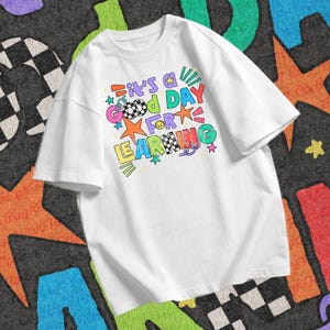 Teacher and student back to school design PNG showing the phrase It’s a Good Day for Learning in bold colorful doodle text.