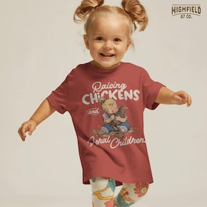Chicken lover PNG showing a cute kid sitting with a hen and funny farm style lettering for country shirts.