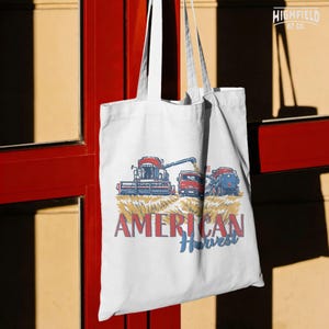 Country Farm PNG featuring American Harvest text, red farm machinery, wheat crop, and USA flag for rural farmer shirt graphics.