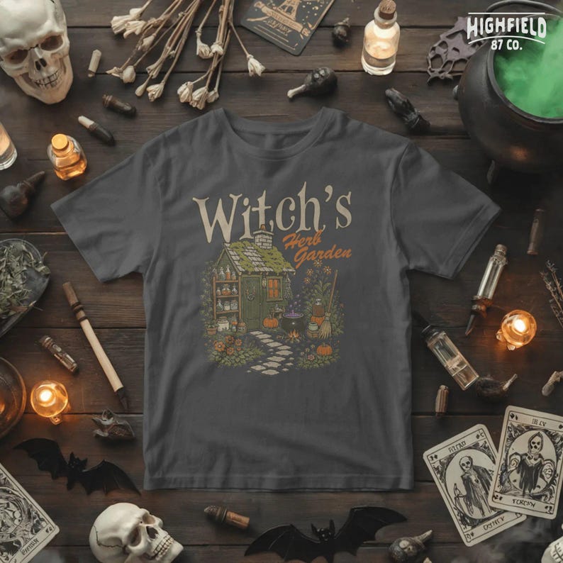 Witch garden PNG featuring a small cottage surrounded by herbs, flowers, pumpkins, potion bottles, broom, and bubbling cauldron.