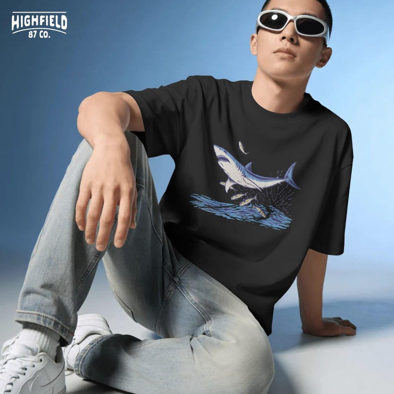 shark shirt png with jumping shark and splash water effect, coastal fishing inspired artwork