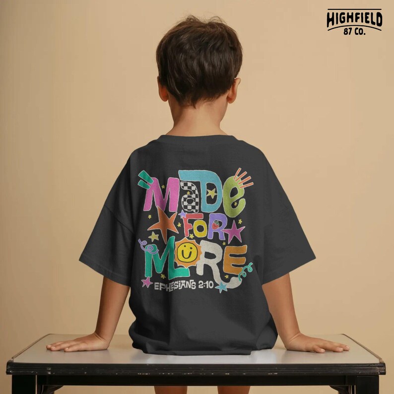Positive kids PNG featuring bright doodle letters and Ephesians 2:10 scripture for encouraging Christian school apparel.