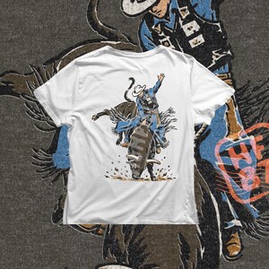 Rodeo cowboy PNG design with a rider on a powerful bucking bull, western action artwork, and bold outdoor rodeo energy for shirt graphics.