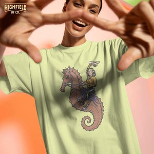 cowgirl riding seahorse with dynamic pose and rope, beach western illustration