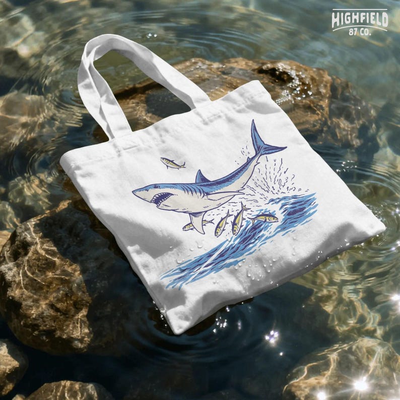 summer ocean png with shark and fish in action scene, bold coastal shirt graphic