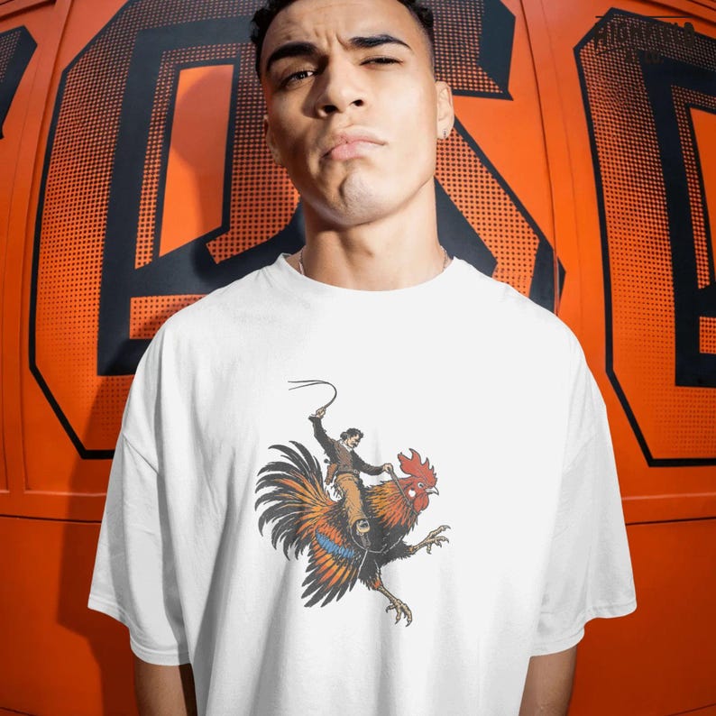Cowboy rooster graphic PNG featuring a wild west rider on a chicken with bold lines and vintage illustration style for funny western apparel.