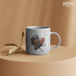 Vintage western rooster PNG design with a cowboy riding a bird in rodeo style, with bold outlines and humorous composition for shirt designs.