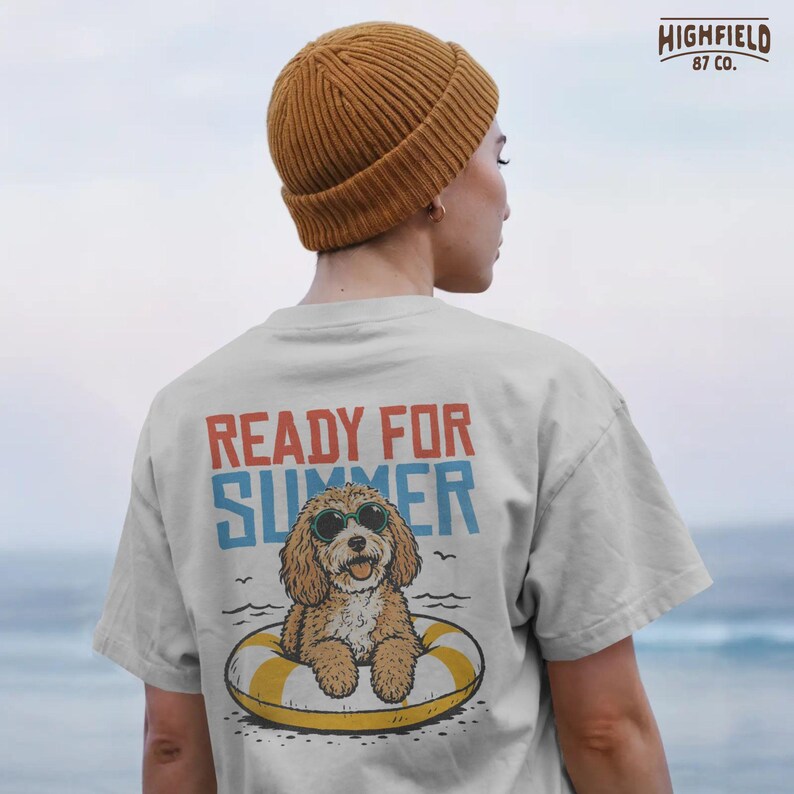 Sunglasses dog PNG showing a cheerful curly puppy sitting in a yellow pool float with bold summer typography and simple water wave accents.