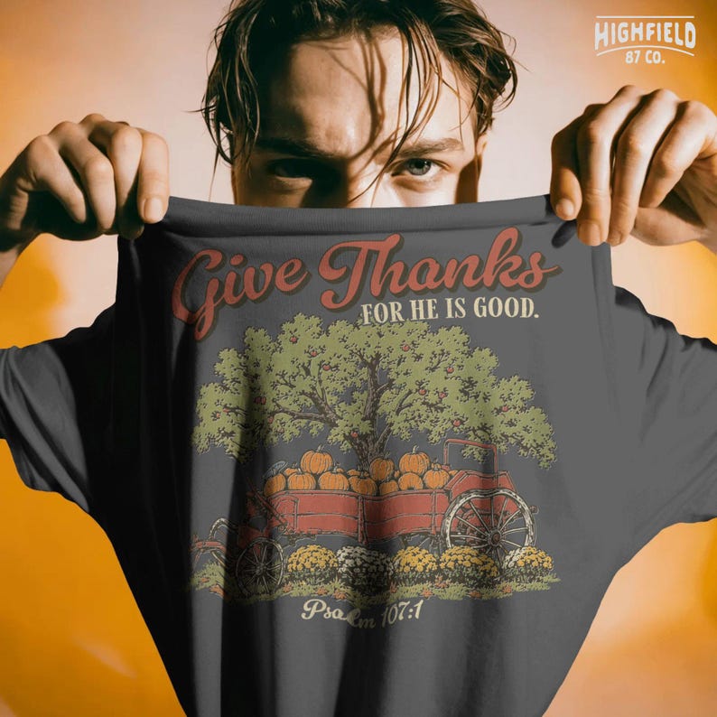 Autumn Christian PNG featuring pumpkins in a wagon with fall flowers and Give Thanks Bible verse lettering.