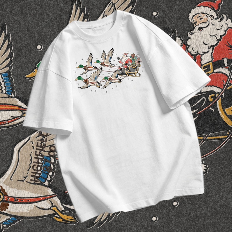Mallard Christmas design showing Santa waving from a black sleigh while four ducks with green heads and brown chests fly in front wearing leather harnesses.