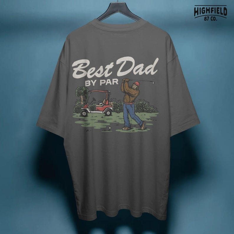 Best dad PNG design showing Bigfoot playing golf on a course, created for golf dad gifts, funny dad shirts, and Fathers Day digital graphics.