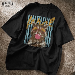 cute raccoon graphic for women and teens who love playful and colorful fashion