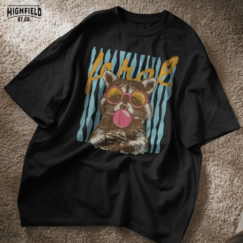 cute raccoon graphic for women and teens who love playful and colorful fashion