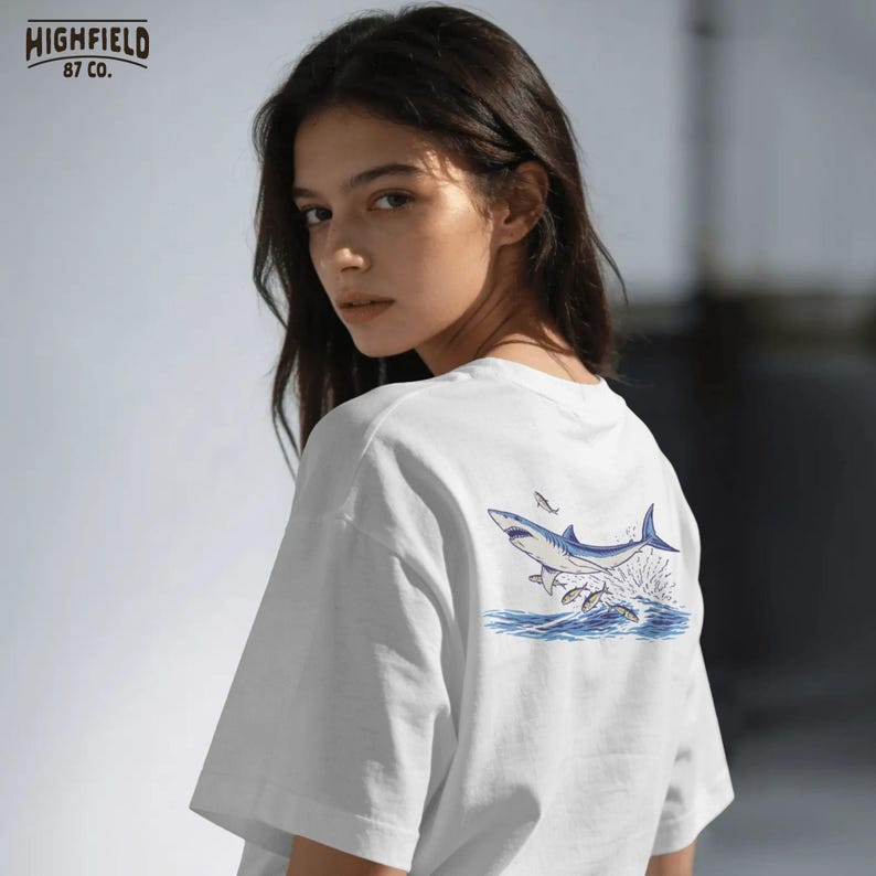ocean animal png with shark and bait fish in motion, bold summer marine design