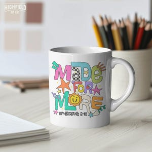 School shirt PNG showing a playful Christian quote design with colorful letters, stars, smiley face, and Bible verse text.