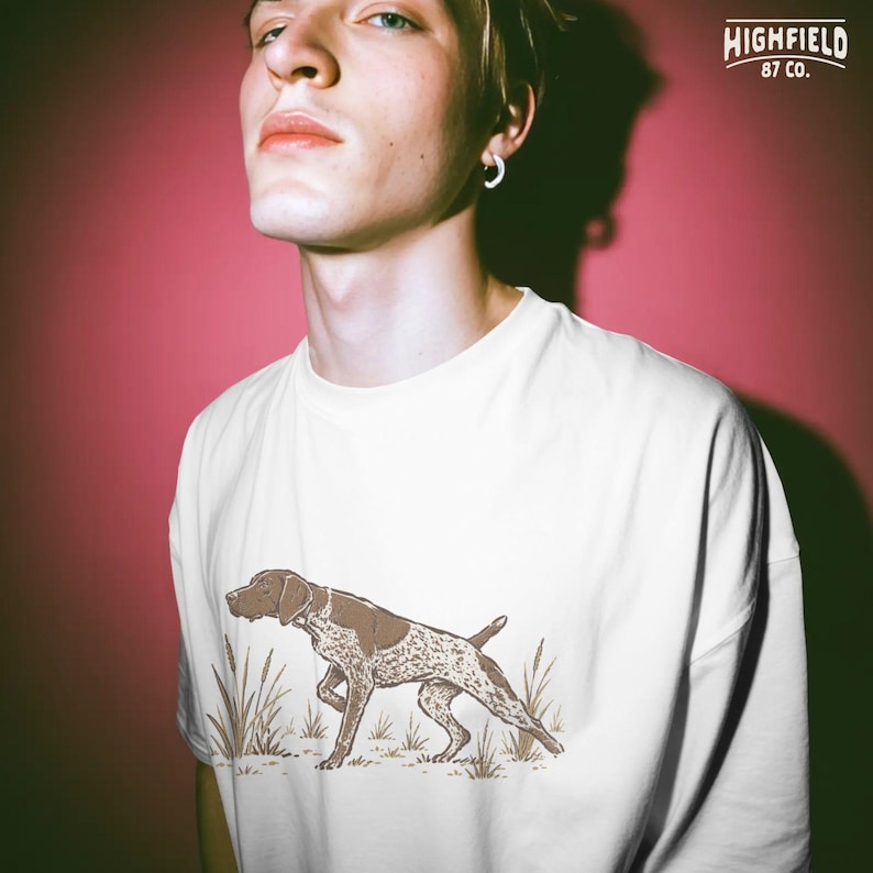 GSP dog PNG featuring a liver and white German Shorthaired Pointer standing in grass for dog lover and hunter shirt designs.