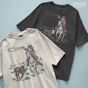 Western Santa illustration showing Santa Claus in cowboy boots and hat on horseback with red and green Christmas lights raised overhead.