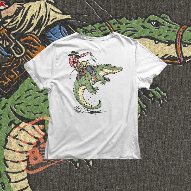 Gator rodeo PNG with cowboy riding alligator in action pose for funny shirt design