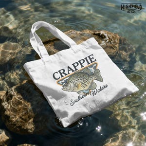 Panfish fishing PNG with a crappie fish illustration, camo background, and southern waters text for freshwater fishing shirt design projects.