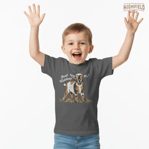 Cute goat PNG showing a baby farm goat with a playful “Just Kidding” phrase, created for sublimation shirts, boutique apparel, and rural themed gifts.