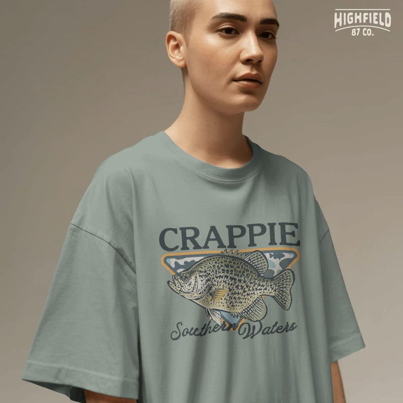 Freshwater fish PNG featuring a crappie with spotted scales, wide fins, and Southern Waters text for fishing shirts, lake trips, and angler gifts.