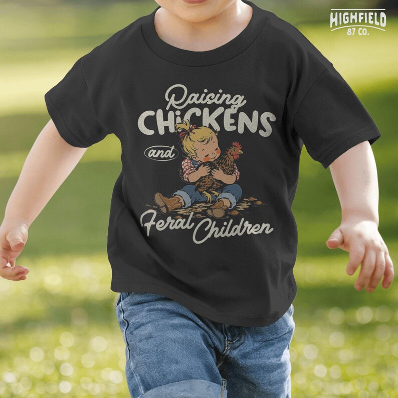 Backyard chicken PNG featuring a child holding a chicken with playful Raising Chickens quote for farm life apparel.