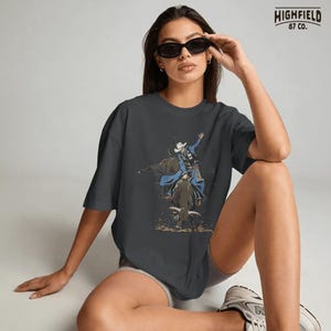 Rodeo season PNG with a cowboy on a bucking bull, flying dirt, western hat, and bold action pose for rodeo event shirt graphics.