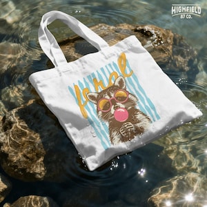 bubble gum raccoon graphic for cute summer shirts and playful clothing