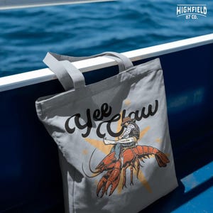 funny fishing crawdad graphic with cowboy rider for unique southern shirt designs