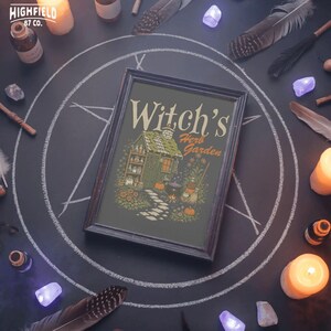 Fall witch shirt PNG showing a witchy cottage with herb garden, stone path, cauldron fire, pumpkins, and Halloween garden details.