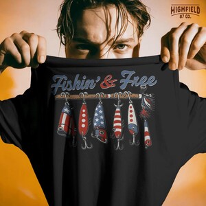 patriotic fishing design showing multiple lures with red white and blue patterns hanging from rod, fishin and free phrase above, detailed fishing gear illustration for anglers, perfect fishing png for t shirt printing, summer outdoor apparel, 4th of july fishing graphic for digital download and merchandise