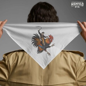 Cowboy humor PNG artwork showing a western rider on a rooster with bold orange and black feathers and dynamic movement for novelty apparel.