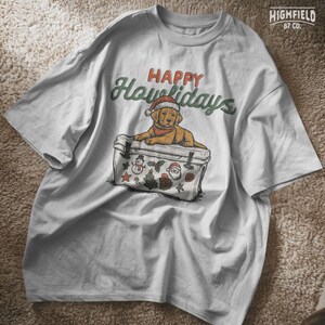 Funny holiday dog clipart featuring lab puppy on cooler with “Happy Howlidays” pun. PNG file for sublimation or digital download Christmas apparel.