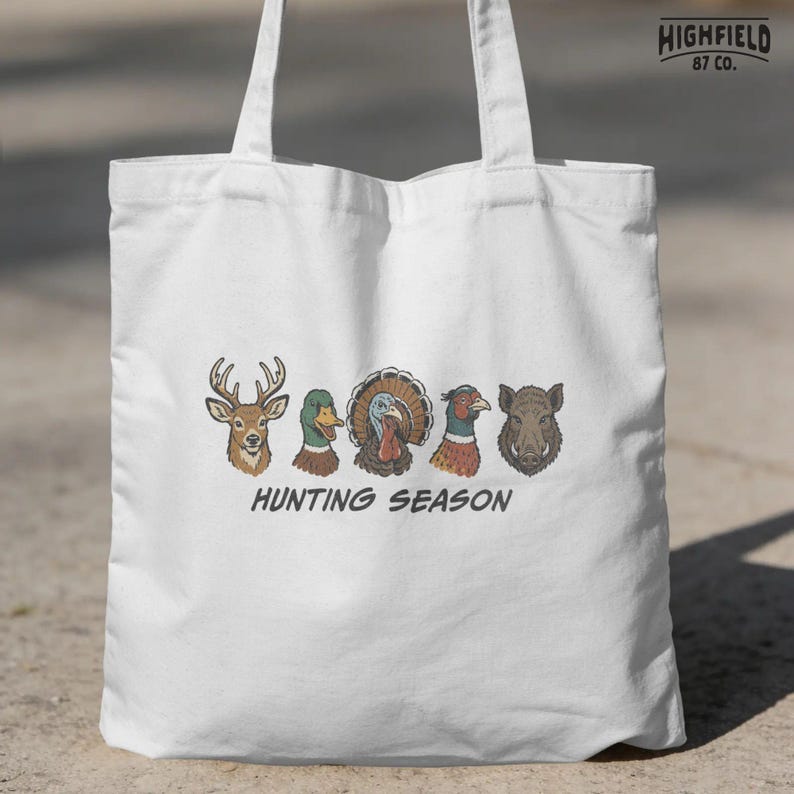 Hunting season shirt PNG featuring deer, mallard, turkey, pheasant, and boar heads for hunters and outdoor sportsmen.